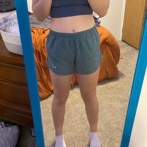 green with white mark athletic shorts